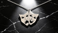 Colgante de máscaras de teatro de plata de ley